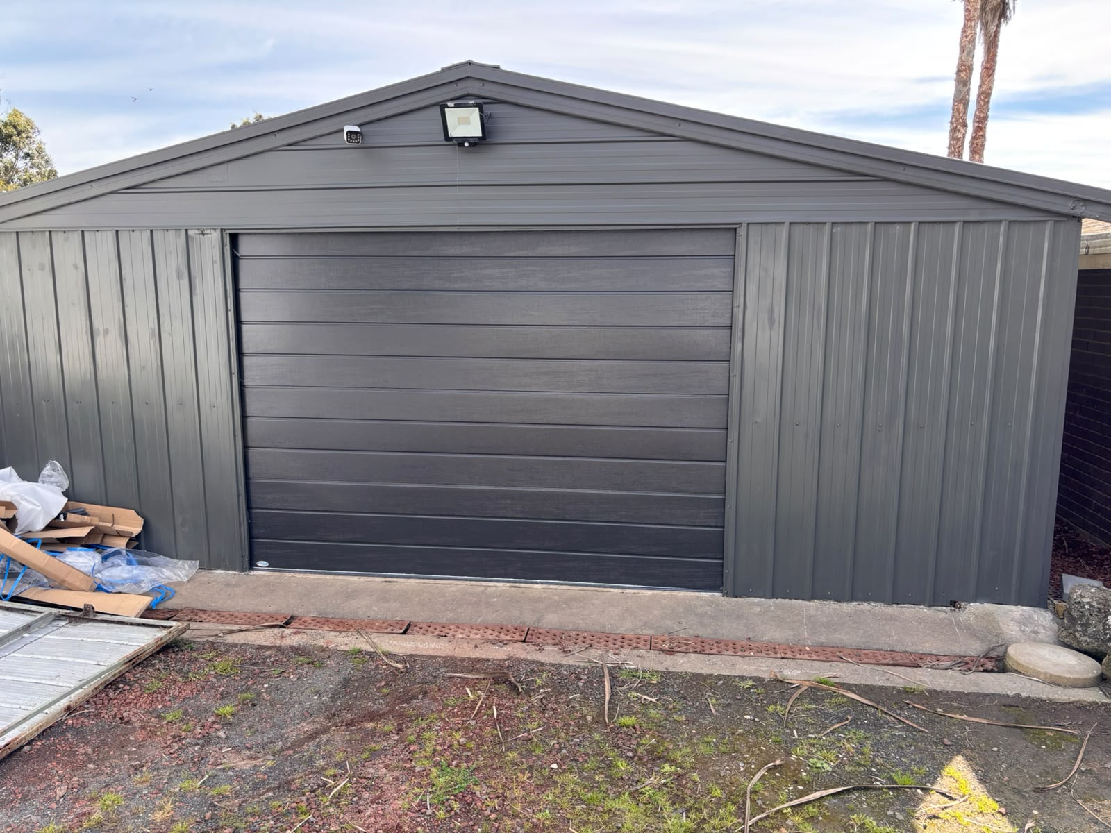 Dark sectional door on a detached garage